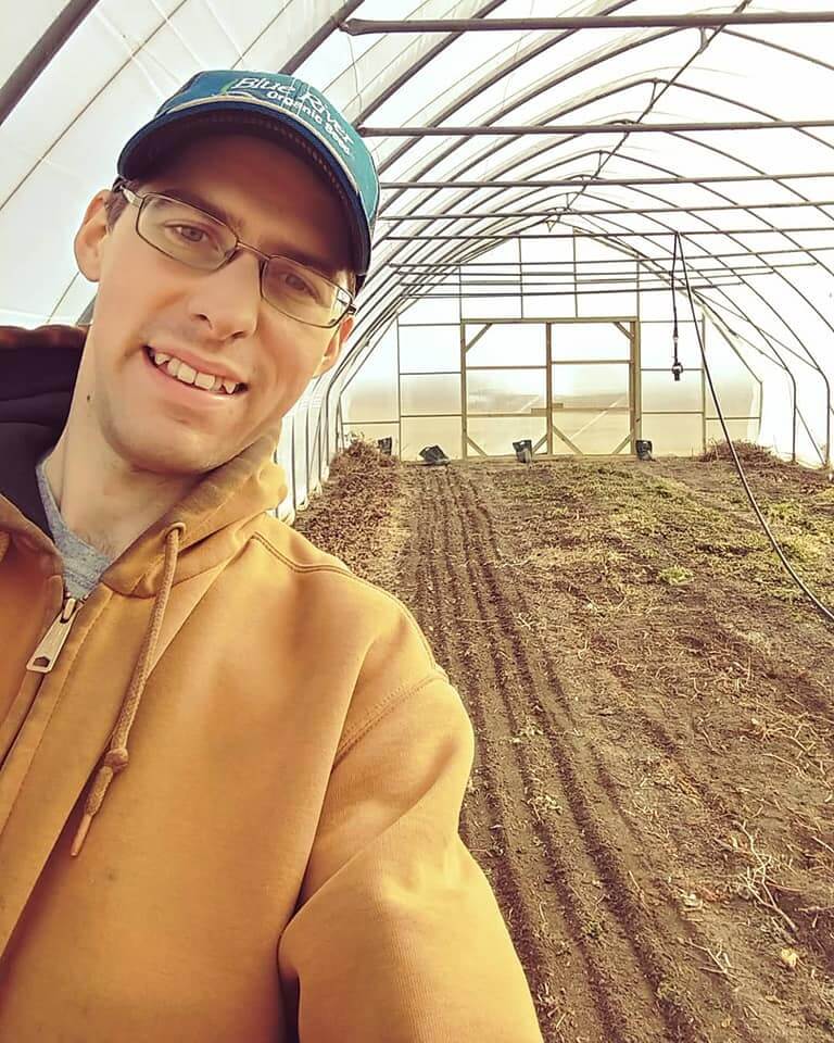 Cottage Hill Farmer in greenhouse
