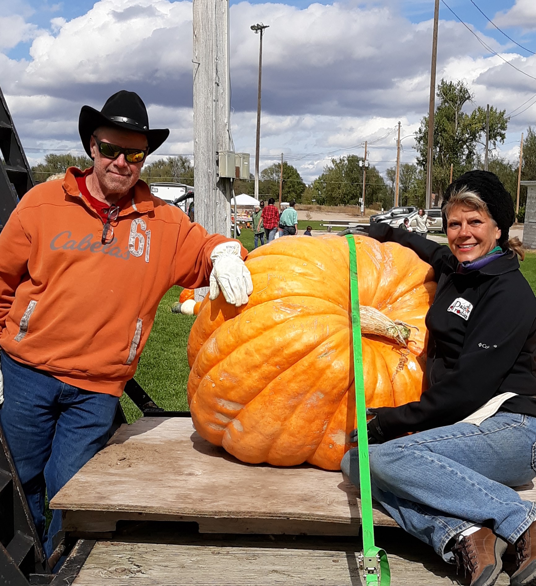 Tracy and Dan Painter of Painter Produce pictured with a giant home-grown pumpkin