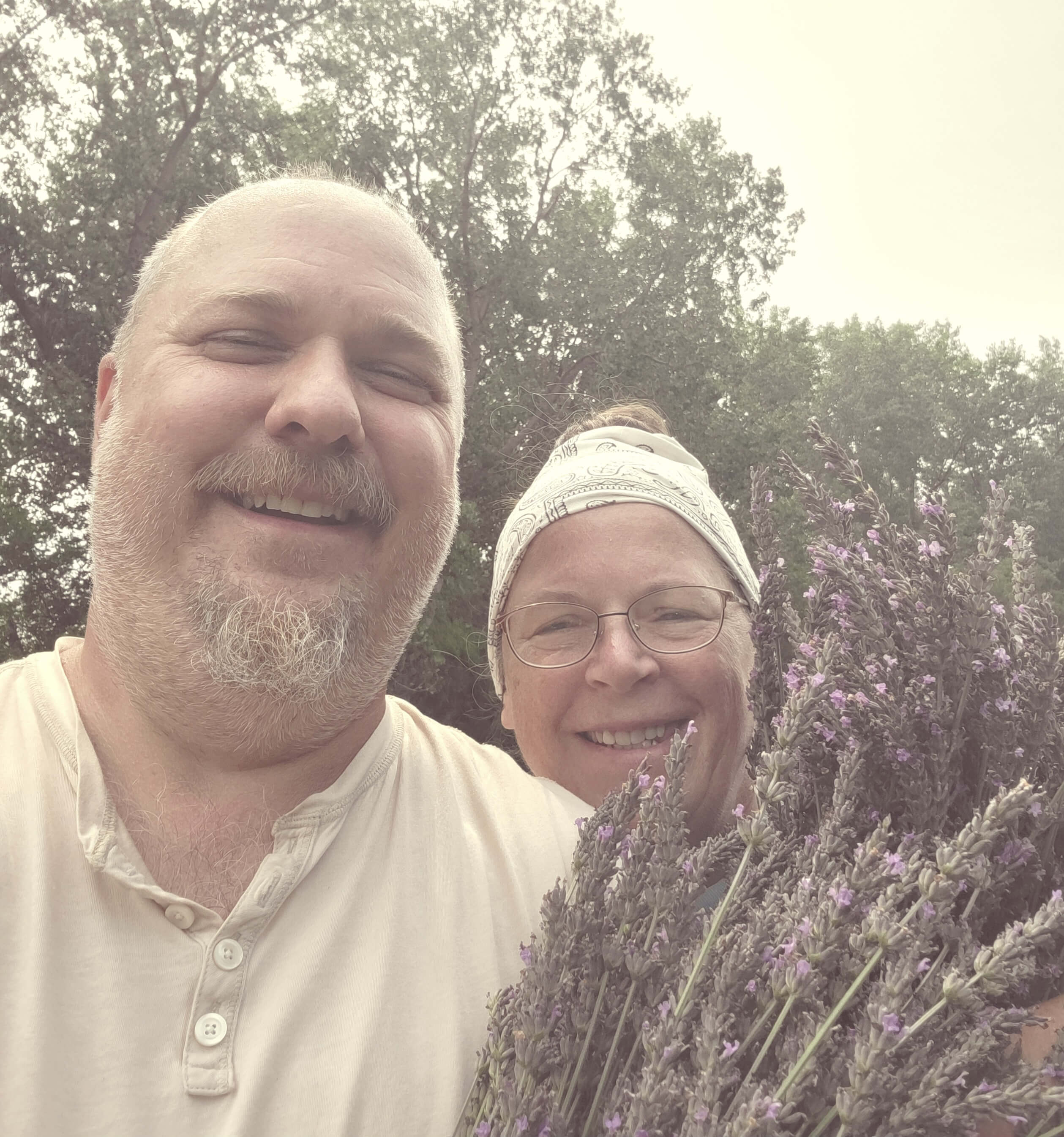 Sleepy Bees Lavender Farm owners holding lavender plants